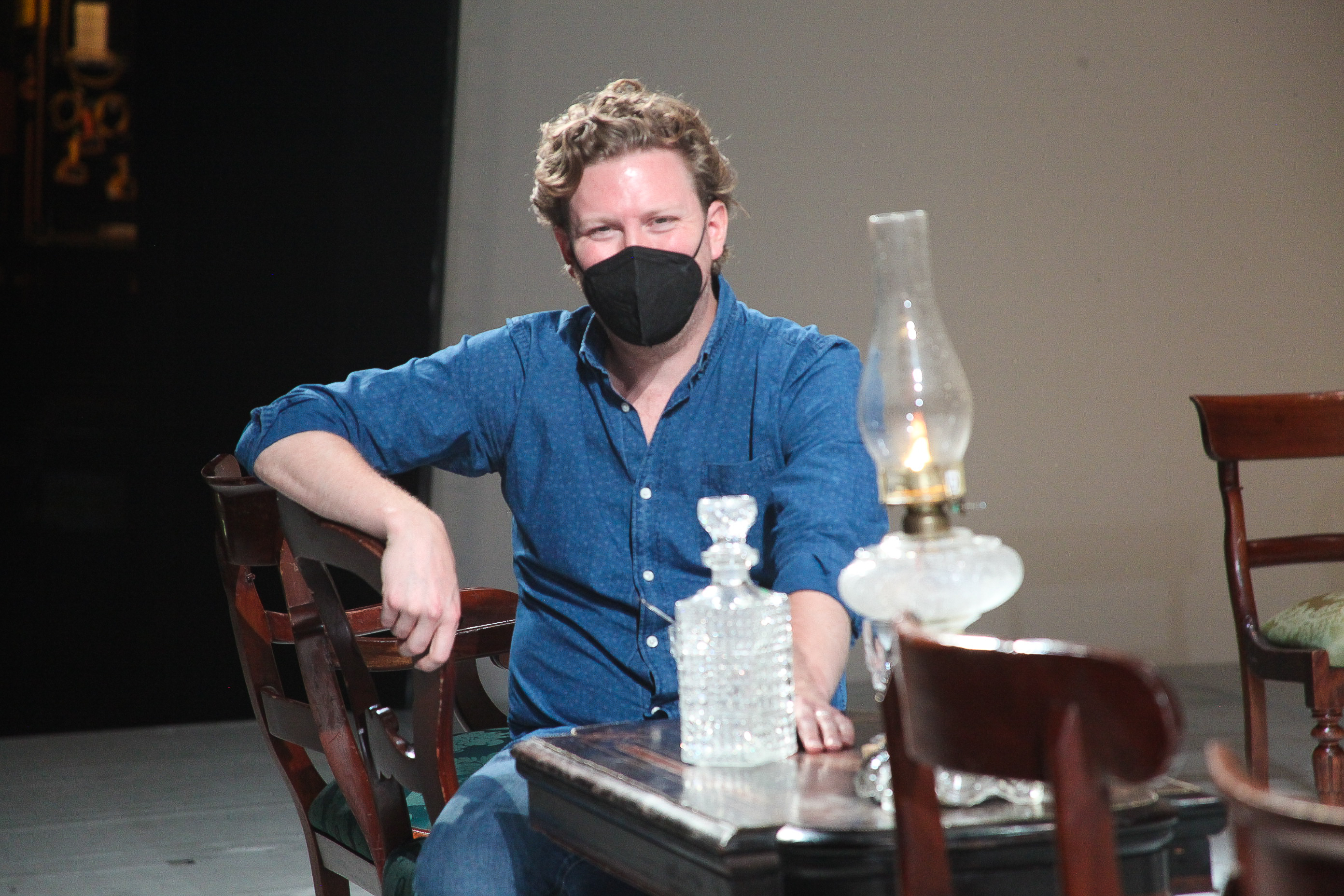 A picture of Gordon Binter sitting in a chair with a facing covering on